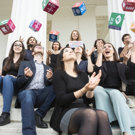 UNSA Vienna team throwing SDG cubes 